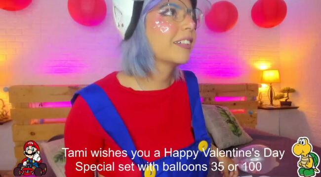 Tamara_Caprice Pops Some Balloons As Part Of A Super Mario Show